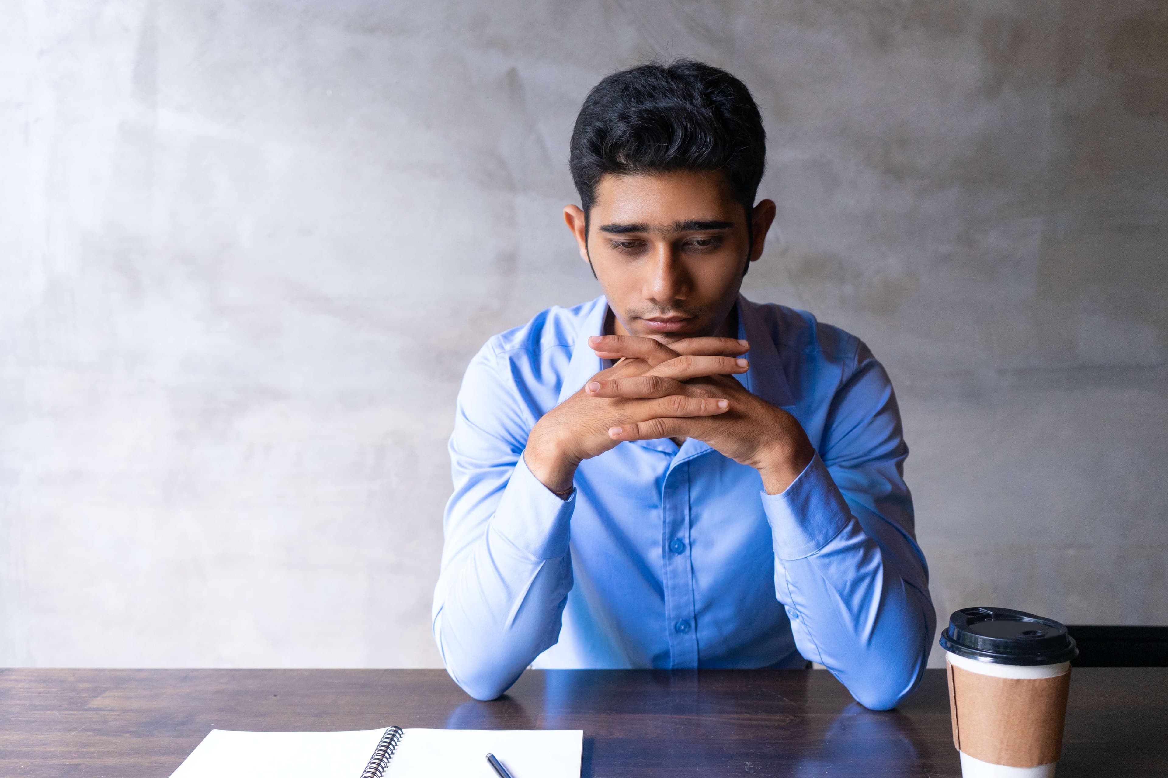 A person meditating peacefully in a calm home environment in Gurgaon to manage stress with our service.